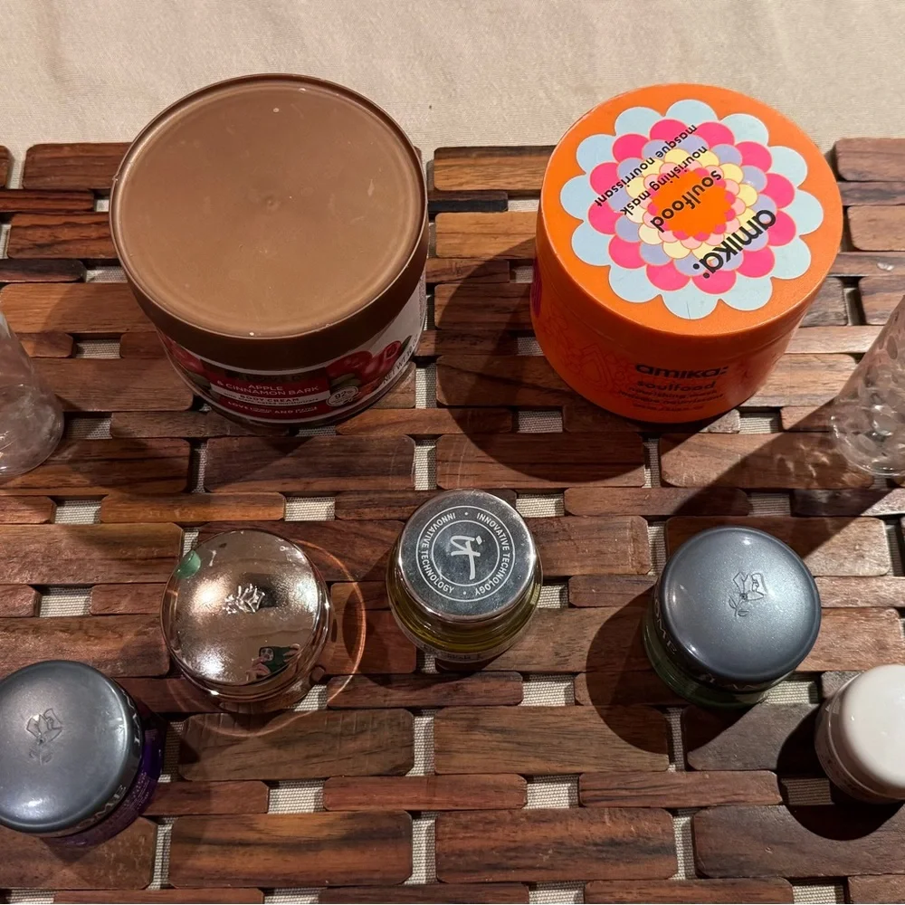 9 empty cosmetic containers: 2 glass ones & 7 plastic ones, variety of sizes